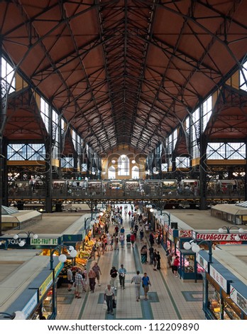 BUDAPEST - CIRCA SEPTEMBER 2012: Tourists and local customers in the Great Market Hall circa September 2012 in Budapest, Hungary. The city\'s largest covered market hall opened in 1897.