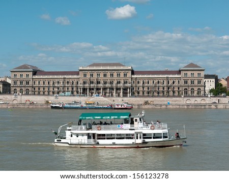 BUDAPEST - CIRCA JULY 2013: Passenger boat running in scheduled service on the Danube river circa July 2013 in Budapest, Hungary.