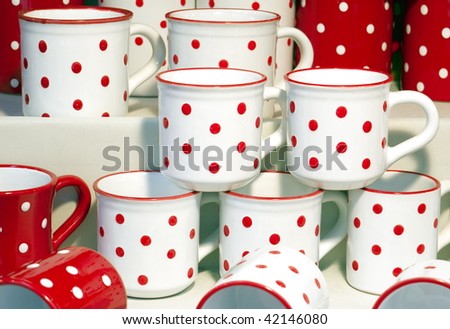 Red and white dotted mugs