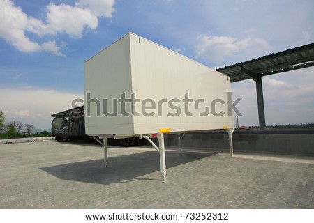 Warehouse building loading bays with empty trailer