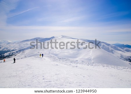 WInter ski resort snow mountains landscape with blue sky in summer sunny day