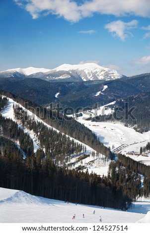 WInter ski resort snow mountains landscape with blue sky in summer sunny day