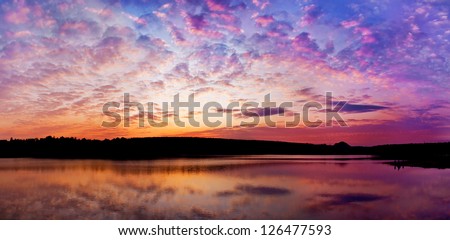 panoramic sunset above the lake with bright colors go very well for site header