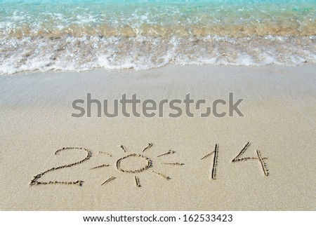 Inscription 2014 On Sea Sand Beach With The Sun Rays Against Wave Foam And Sky - Vacation Concept