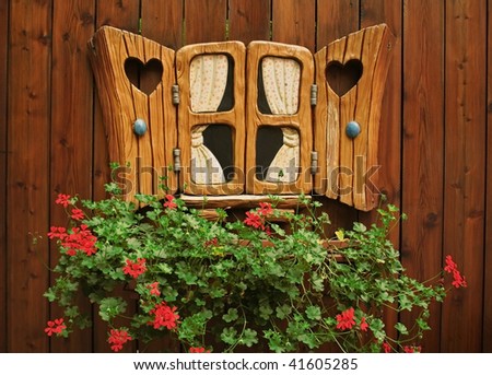 a fantastic window on the background of the wooden walls and colors,