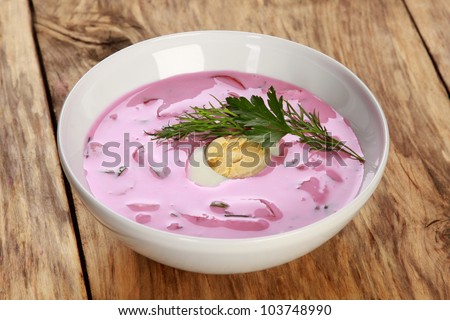 Cold borscht - speciality for hot summer days. Vegetable cold soup with beet, cucumber, radsih and egg .