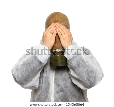 man in full protective clothing wearing a gas mask. closing eyes with hands