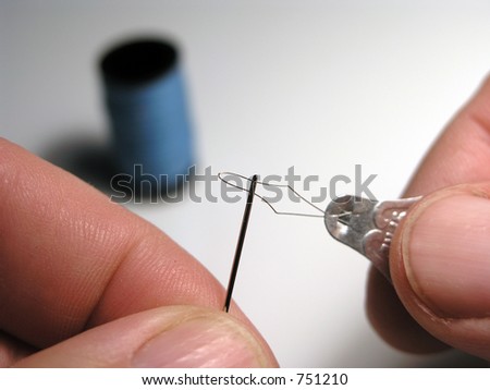 Tool used to thread needles with fine thread.
