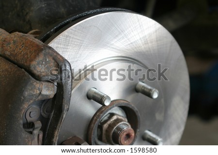 New rotor installed during brake service in a service shop