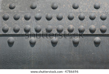 Boiler rivets on a large steam boiler.  Repeating Pattern
