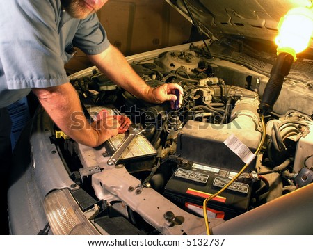 Automotive technician doing repair job.