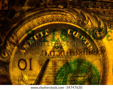 Great Seal of the United States of America revealed on a dollar bill.  The eye of Providence center.