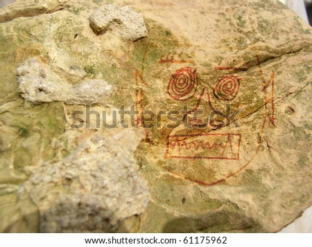 Primitive art (faux) on a rock face