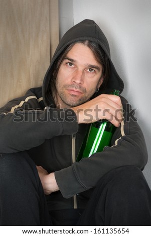 young man with wine bottle