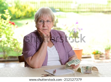 older woman with money