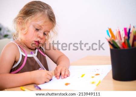 little girl is painting