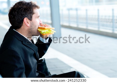 businessman on trip has a breakand eating