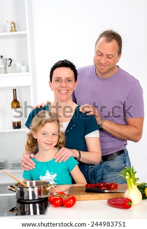 family with one daughter is cooking together