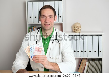 young friendly doctor in her office with money