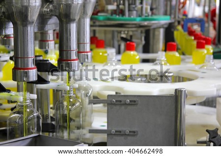 Liquid detergent on automated production line. Machinery for bottling