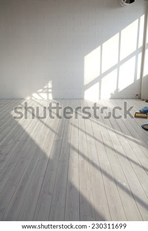 White empty loft interior with window shadow