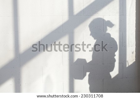 White empty loft interior with window and girl shadow