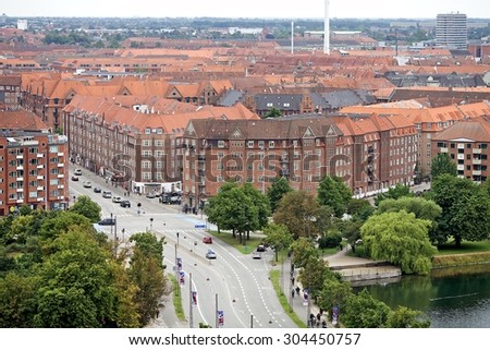 COPENHAGEN, DENMARK - 27 July 2015: Bird\'s eye view of the city. Panorama of colorful roof tops and old churches in Copenhagen, Denmark