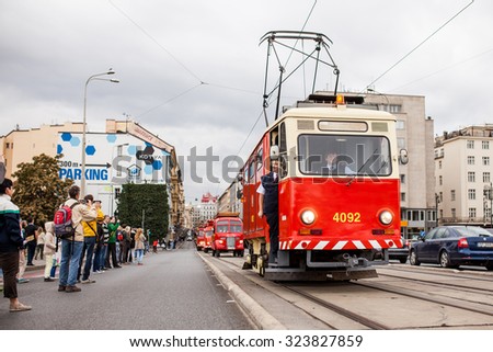 PRAGUE, CZECH REPUBLIC - SEPTEMBER 20, 2015: The vintage excursion tram parade goes on the central city street in Prague. 140 years of public transport.