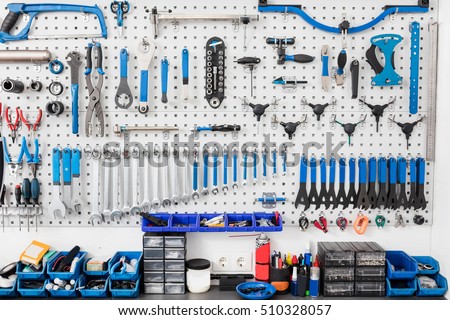 Bicycle tools in the board. Bike mechanic garage with workshop tools wall. Repair concept.
