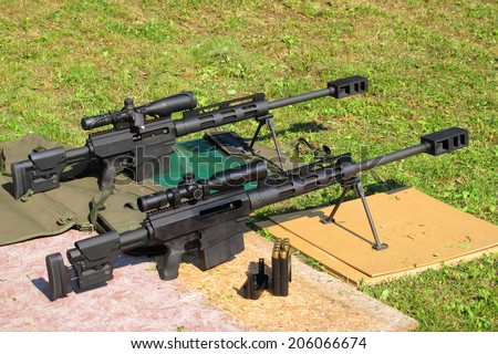 Two sniper rifles .50 BMG caliber on shooting range. With .50 BMG cal. (Browning Machine Gun) was made second longest kill in military history at 2,430 meters (2,657 yards) during the Afghanistan War.