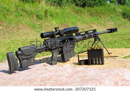 Sniper rifle .50 BMG caliber with riflescope for long range.