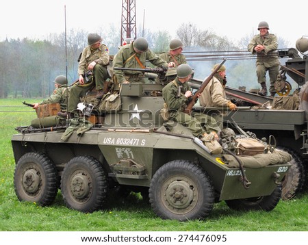 DOBRANY, CZECH REPUBLIC - MAY 1, 2015: American M8 Greyhound with soldiers. Liberation festival to 70th Anniversary of the Liberation by the US Army and the End of the Second World War in Europe.