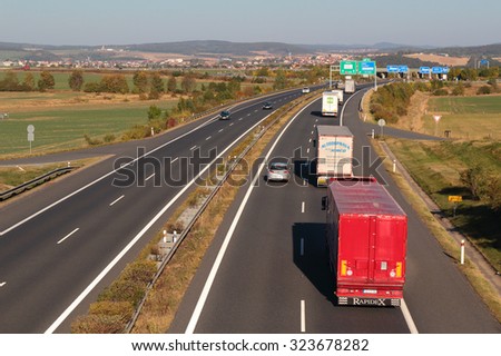 PILSEN, CZECH REPUBLIC - OCTOBER 2, 2015: Line of trucks on the D5 highway. The D5 is important transport connection between West Bohemia and Bavaria in Germany.
