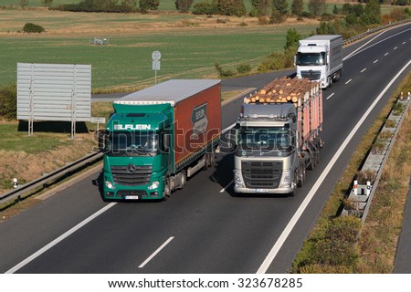 PILSEN, CZECH REPUBLIC - OCTOBER 1, 2015: Dangerous overtaking of trucks on D5 highway. Cause of frequent car accident. The D5 is important transport connection between West Bohemia and Germany.