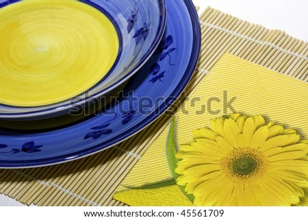domestic place setting with handmade plates and napkin