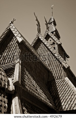Sepia toned image of staggered roof pitch from a Nordic wooden chapel. Visually pleasing.