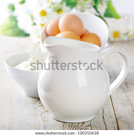 Jug with milk and eggs
