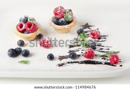sweet christmas tree with berries on a white plate