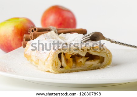 Sweet apple pie and red apples