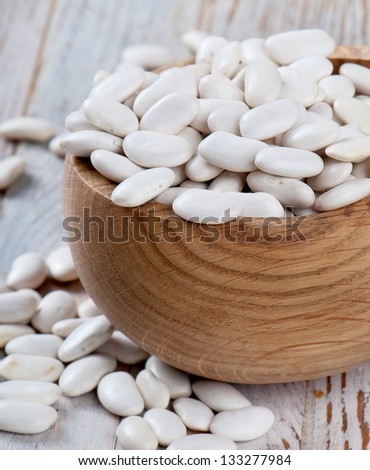 white beans on a wooden table