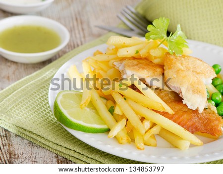 British food - fish and chips on a wooden table
