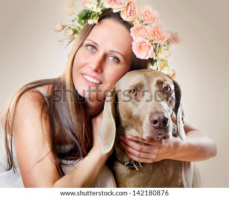 Beautiful smiling woman with dog.Vintage styled portrait