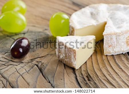 camembert cheese and grapes. Selective focus