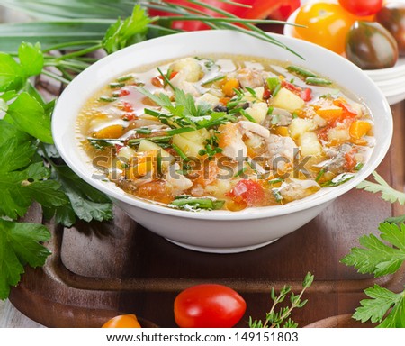 Bowl of vegetable Soup with chicken. Selective focus
