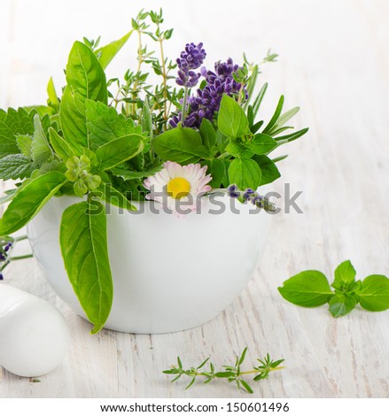 Fresh herbs on a wooden table
