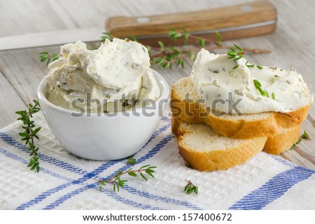 fresh cream cheese with herbs. selective focus
