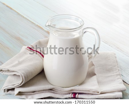 Milk  on wooden table. Selective focus