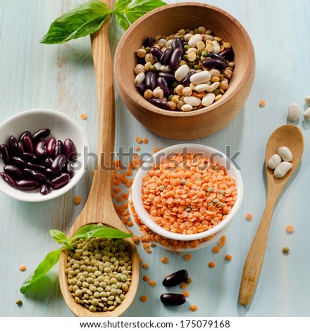 Beans and lentil on a wooden table . selective focus