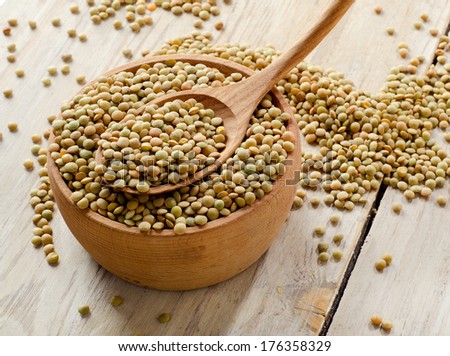 lentils on a wooden table . selective focus