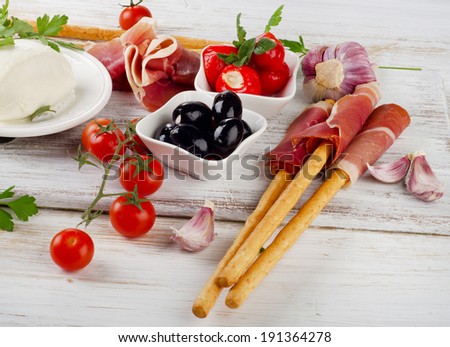 italian appetizer - Mixed Antipasto on a wooden table . Selective focus